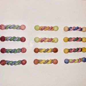 A set of 10 MacKenzie Childs twist pulls